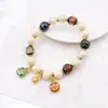 Yonghe Qifu Pulsera de Esmalte Cerámico Rosa Azul Golondrina Bestia Dorada Pulsera de Bebé Wen Juego Joyería para la Mano Estilo Chino Venta al por Mayor