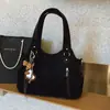 Bolsa de Mão Versátil Nova Outono e Inverno 2025 Bolsa de Ombro Feminina Bolsa Tote de Grande Capacidade para o Dia a Dia Bolsa Transversal Bolsa de Viagem