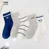 Calcetines para niñas Yishuangshuang, nuevos calcetines de otoño e invierno con forma de corazón de dibujos animados hasta la mitad de la pantorrilla, algodón peinado, calcetines estilo Miu con letras y caras sonrientes para estudiantes