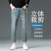 Jeans elásticos de 8/9 de largo para hombre Guangzhou Xintang, modernos y versátiles para primavera y otoño, de moda para personas bajas de 160 cm