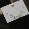 Pendientes pequeños de una semana, populares pendientes pequeños de aguja de plata S925, una tarjeta, tres pares de pendientes de combinación de traje, pendientes de circonita roja de red para mujer