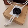 Cinto de corrente de cintura com pérolas de camélia feminino nova decoração com vestido 2024 nova corrente fina corrente de cintura atacado