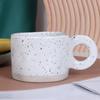 Taza de café de cerámica para exportación transfronteriza Taza con asa para el hogar Punto de pulverización cóncavo y convexo Efecto de tinta salpicada Taza de agua Taza de cerámica