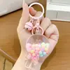 Desenho animado de areia movediça urso dos sonhos menina chaveiro cor de leite em pó boneca fofa pingente de bolsa casal presente pequeno atacado