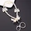 Nuevo Colgante Creativo de Cadena Colgante con Lazo de Perlas para Bolso, Funda de Teléfono, Llavero, Adorno, Exquisito Accesorio de Regalo Pequeño