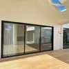 Exportación de comercio exterior de puertas y ventanas de aleación de aluminio con rotura de puente térmico para proyectos australianos, venta al por mayor de puertas corredizas de alta resistencia, puertas corredizas de piso a techo para balcones de villas