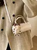 Moda Primavera 2026 Diseño de Nicho Bolso Cruzado de un Solo Hombro para el Trabajo y los Viajes Cotidianos Bolso Pequeño Cilíndrico Retro para Mujer