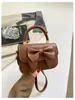 Bolso de mano con lazo lindo transfronterizo para mujer 2026 nuevo estilo moda nicho bandolera bolso cruzado versátil de moda moderno