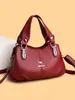 Bolsa de alta qualidade e elegante para mulheres, coleção outono/inverno 2026, com design simples, múltiplos compartimentos, e pode ser carregada na mão ou usada como bolsa de ombro ou bolsa transversal.