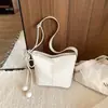 Bolso retro simple transfronterizo para mujer 2026 nuevo bolso de hombro cruzado casual versátil para el trabajo y los desplazamientos bolso tipo cubo