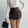 Estilo Europeu e Americano Outono e Inverno Moda Elegante Couro PU Cor Sólida Colagem Costura Zíper Cintura Alta Quadril Shorts Saia