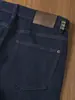 Jeans Clássico Original Lavado com Enzima de Vaca Antidesbotamento Outono e Inverno Cor Original Denim Versátil Casual Business Reto Slim
