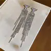 Pendientes minimalistas de plata con aguja, diamantes y borlas, que ofrecen un lujo ligero y una sensación de alta gama, elegantes y sencillos, versátiles y elegantes.