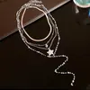 Collar con colgante de corazón de circón con cuentas de perlas estilo coreano, juego de cuatro piezas, cadena para la clavícula de lujo ligero y de alta gama, accesorio versátil para mujer