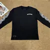 Camiseta negra de moda para hombres y mujeres, de manga corta, estampado en sánscrito, nuevo estilo de verano, corte holgado, adelgazante, oversize, top popular en línea