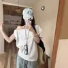 Camiseta Retro Americana de Cuello Asimétrico Off-Shoulder con Nudo Manga Corta para Mujer en Verano Holgada Estilo Perezoso Versátil Top de Media Manga