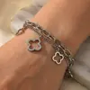 Pulsera de Acero Titanio con Trébol de Cuatro Hojas Incrustado de Diamantes de Alta Gama, Resistente al Desvanecimiento, Lujo Ligero, Versátil, Estilo de Nicho, Adecuada para Usar en la Ducha