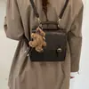 Mochila simple de invierno con charm de dibujos animados coreanos cruzado, oso lindo de mano, nuevo bolso de hombro estilo japonés 2026 para mujer