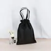 Bolsa de cordón no tejida En stock Bolsas Juguetes Publicidad Mochila para estudiantes En stock Portátil a prueba de polvo Bolsa de regalo