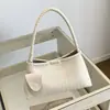 Bolso de axila tejido de diseño de nicho de alta gama transfronterizo para mujer, nuevo bolso de mano 2026, elegante bolso tipo cubo de un solo hombro