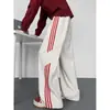 Pantalones de estilo americano con patrón de escamas de dragón en bloques de color para hombre, pantalones deportivos casuales de pierna recta para otoño, pantalones holgados de pierna ancha, modernos y elegantes