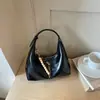 Bolsa de axila lisa estilo preguiçoso 2026 verão nova bolsa de bolinho alta para trabalho e trajeto bolsa de ombro único transversal
