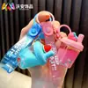 Llavero de taza de té con leche de frutas rellena de aceite lindo colgante de bolsa de arena movediza líquida pequeños accesorios de regalo al por mayor