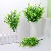 Plantas Verdes Simuladas Eucalipto de 7 Galhos Arranjo de Flores para Canteiro de Restaurante Decoração Grama da Fortuna Flores Artificiais de Plástico Venda por Atacado