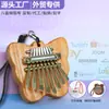 Mini piano de pulgar más vendido transfronterizo, kalimba de cristal acrílico de 8 tonos, instrumento musical tocado con los dedos, adorno colgante popular