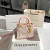 Una generación de bolsa de toffee de encaje de alta gama 2024 nuevo bolso de mano de lazo de verano bolso cuadrado pequeño al por mayor