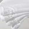 Al por mayor 230 gramos de camiseta blanca de algodón con hombros caídos pesados, manga corta, para hombre y mujer, color liso suelta, camiseta básica de marca de moda
