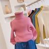 Ropa suave y cerosa para niños y niñas 2025 Otoño e Invierno Nuevo Cuello alto Versátil Rayas de punto Color puro Ropa de punto Camiseta básica