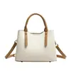 Bolsas de mano al por mayor transfronterizas, nuevos bolsos de hombro simples en bloques de color, bolsos versátiles y de moda para el uso diario, bolsas personalizadas