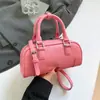 Bolsa de mão de boliche feminina única 2026 novo modelo de primavera bolsa de ombro simples transversal bolsa almofada da moda