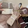 Songmu "Meias de Cashmere com Botão Estilo Coreano Femininas Outono Inverno Novas Engrossadas Microcompressão Meio da Panturrilha Meias Largas Tendência"