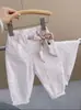 Calça Infantil Rantuo 2026 Novo Estilo para Crianças Médias e Maiores Série Branca Design Unissex Simples Tendência Calça Longa Transfronteiriça