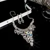 Aretes y collar de dos piezas con colgante de flor y gota de agua incrustados con diamantes, cadena para la clavícula de moda y exquisita, joyería de lujo ligero y de alta gama para mujer