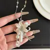 Collar de Perlas y Gotas de Agua con Flor de Lirio Estilo Coreano Ins para Mujer, Accesorio de Cadena Larga para Clavícula con Colgante de Flor de Lirio