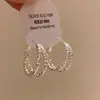 Pendientes multicapa con forma de óvalo y rombo, diseño de lunares con gota de aceite y aguja plateada, sensación de lujo ligero y alta gama, pendientes de moda y versátiles
