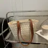 Bolso de Paja Tejida de Verano Transfronterizo 2025 Bolso de Playa para Vacaciones en la Costa Gran Capacidad de Paja Versátil Bolso de Hombro Tipo Cubo