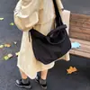 Bolsa de Lona Elegante da Moda Feminina Outono e Inverno 2025 Nova Bolsa de Mão de Grande Capacidade Bolsa Tote Ombro para Estudante e Comutador
