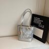 Bolso de Mano Pequeño con Bloques de Color en Relieve de Moda Transfronterizo para Mujer 2026 Nuevo Bolso de Hombro Versátil para el Trabajo Bolso Cubo de Primavera