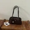 Bolso de axila retro de moda transfronterizo para mujer, nueva colección 2026, diseño de alta gama, estilo de nicho, elegante, adecuado para el trabajo, se puede llevar en la mano o usar como bolso de hombro