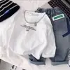 Camiseta de manga larga de algodón puro para niños, estilo primavera y otoño, corte holgado, para niños, niños medianos y mayores, cuello redondo, fina, top casual, capa base, moderna