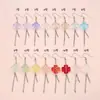Pendientes de borla de flor de rosa de temperamento suave y borla de trébol de cuatro hojas, frescos, conmovedores, simples, naturales, florales, adecuados para varios