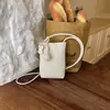 Bolso cruzado de cuero suave de alta gama a la moda para teléfono móvil, Bolso cuadrado pequeño versátil simple y elegante, Bolso cubo de alta gama con bola tejida