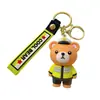 Llaveros de dibujos animados transfronterizos de policía, bombero, policía de tráfico y oso, inodoros y lindos, colgantes para coche y bolso, regalos de figuras