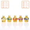 Garrafa octogonal de óleo essencial de alta qualidade com estampagem a quente colorida 12ml 6ml frasco roll-on frasco de amostra de perfume frasco roll-on portátil para viagem
