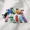 Pintura colorida liga mola fivela de furo duplo fivela de mola de tensão espiral material de acessórios de joias diy mola de tensão atacado