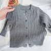 Suéter tejido para niños, colección otoño 2026, nuevo suéter de punto trenzado liso, top de punto elegante para niños y niñas